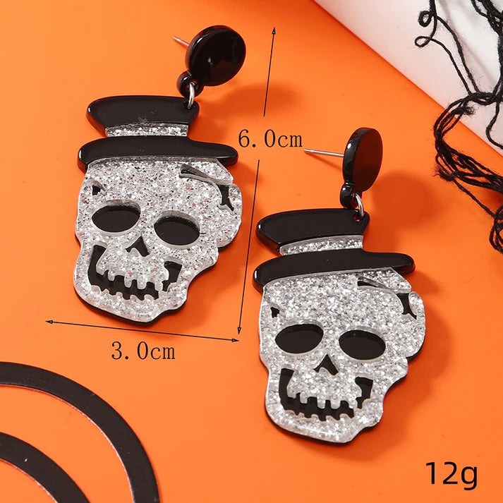 Aretes de calavera plateada
