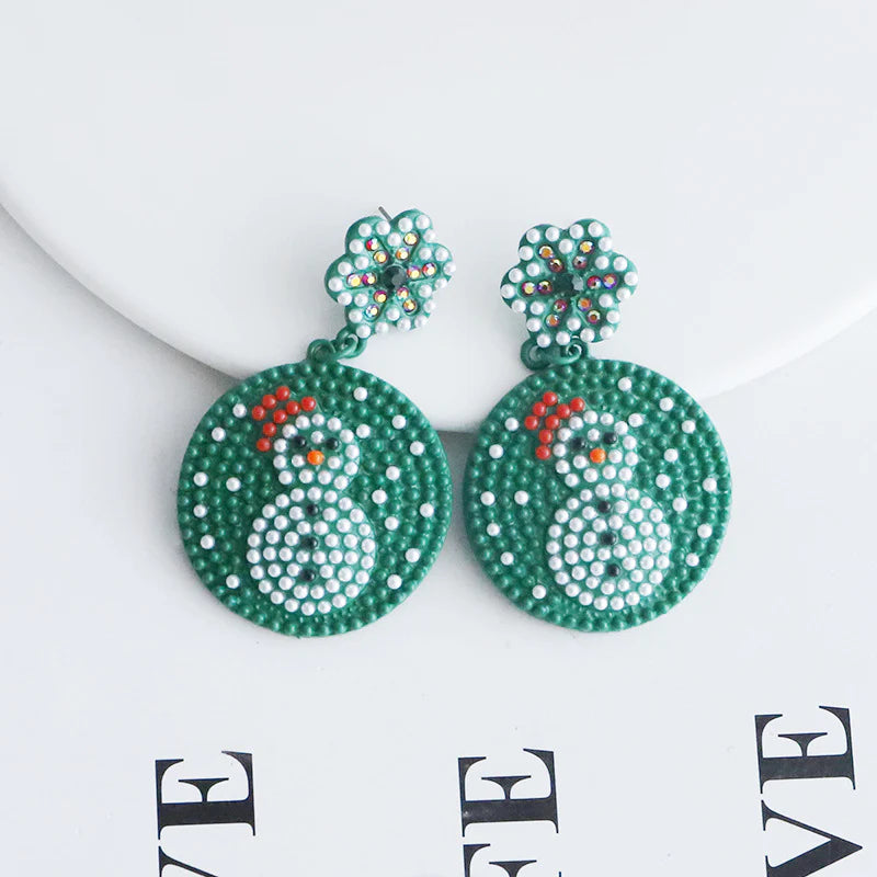 Aretes verdes de oso de nieve